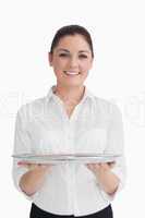 Waitress holding tray with two hands