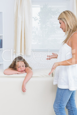 Mother explaining something to her daughter