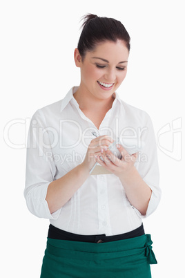 Smiling waitress taking order