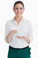 Waitress holding cup