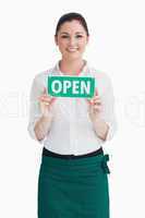 Waitress holding open sign