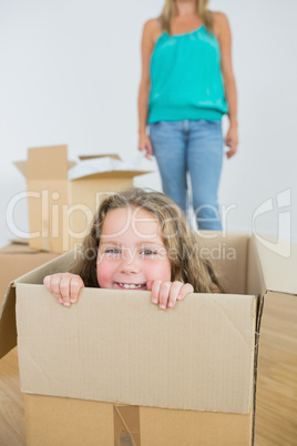 Laughing girl in moving box