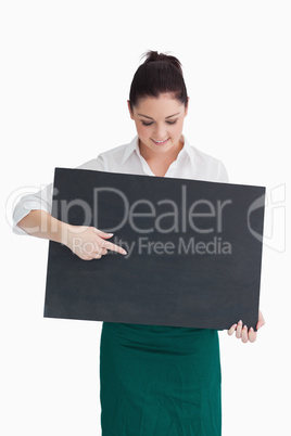 Waitress pointing and looking at board Waitress pointing and looking at board