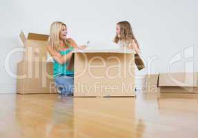 Mother and daughter unpacking