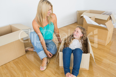 Mother and daughter laughing together