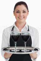 Waitress holding two glasses of wine