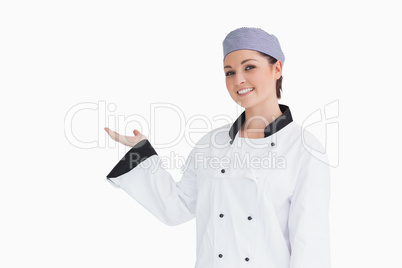 Happy chef showing something