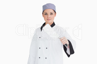 Cook holding a meat cleaver
