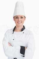 Smiling cook wearing a chef hat