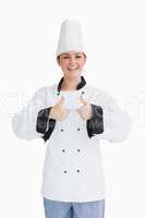 Joyful cook having the thumbs up