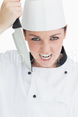 Furious cook holding a knife