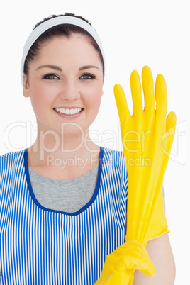 Cleaner woman wearing yellow gloves