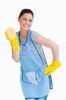 Cleaning woman presenting a sponge