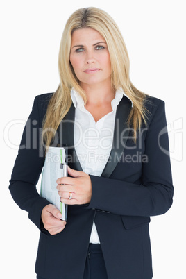 Serious business woman posing with a clipboard