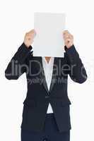 Business woman holding a white panel in front of her face