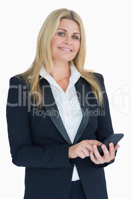 Cheerful business woman using her smartphone