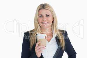 Smiling business woman holding a coffee cup