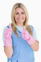 Cleaner putting thumbs up with pink gloves