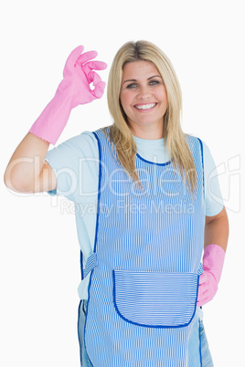 Cleaner woman making ok hand sign
