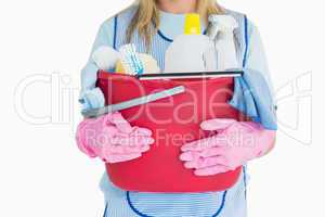Cleaning woman holding a bucket of cleaning supplies