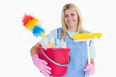 Cleaner holding a bucket with a broom