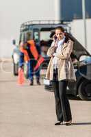 Woman on the phone after car breakdown