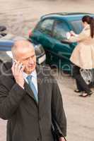 Man on the phone after colliding car