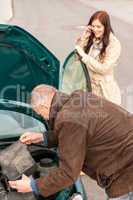Woman on the phone having car problems