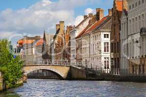 Facade of flemish houses and canal in Brugge