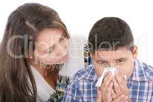 Child blowing nose. Child with tissue. catarrh or allergy