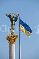 The Independence monument and ukrainian flag in Kiev, Ukraine, E