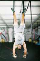 The sportsman the guy, carries out difficult exercise, sports gy