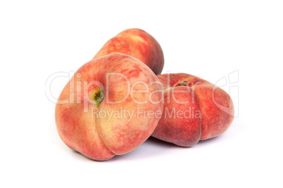 Three ripe fig peach on white