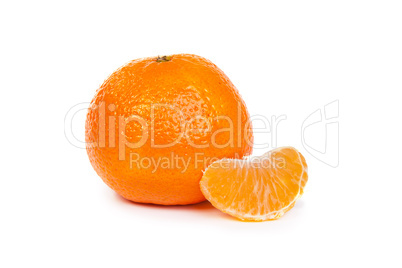Ripe tangerine or mandarin with slices on white