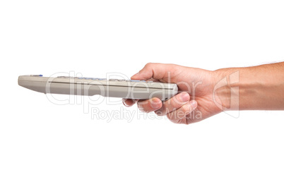 A hand holding a remote control isolated