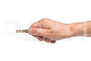 Male hand holding a key to the house
