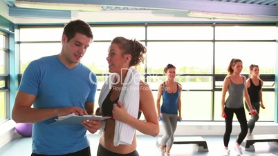 Woman talking with trainer