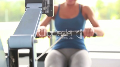 Woman training on a rowing machine