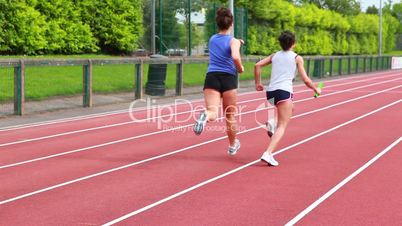 Two women in relay race