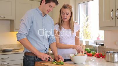 Couple preparing salad