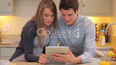 Couple looking at a tablet PC