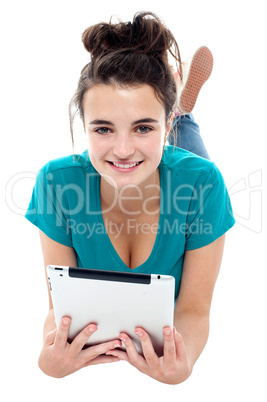 Glamorous pretty girl posing with wireless tablet