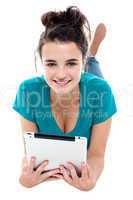 Glamorous pretty girl posing with wireless tablet