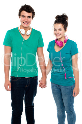 Young couple with headphones around their necks