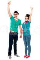 Strong bonding of cheerful teen couple enjoying music