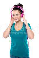 Cheerful pretty girl listening to music