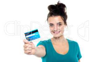 Girl showing her cash card, arm stretched out