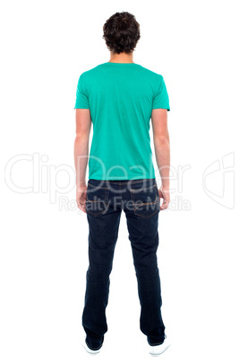 Rear view of teen guy in casuals