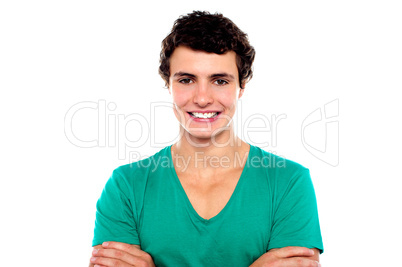 Stylish trendy guy posing with folded arms