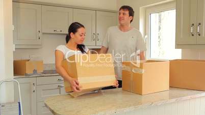 Couple proudly put moving boxes in the kitchen